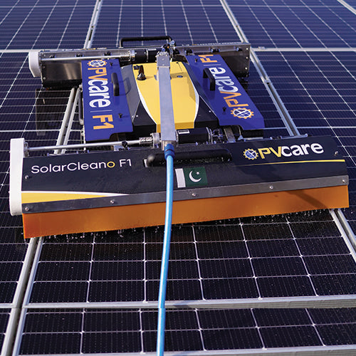 A solar panel cleaning robot from Fvcare, named SolarCleano F1, mounted on a solar panel system.